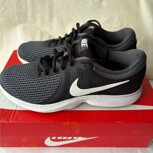 Nike Black and White Sneakers with Mesh Upper‎ and Cushioned Soles